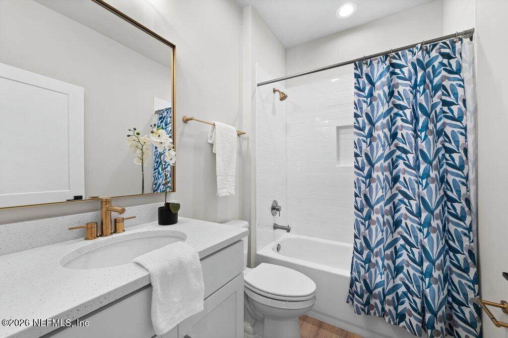 9019 Hipps Road Jacksonville, FL 32222 - Photo 9 of 35 a bathroom with a sink toilet and shower