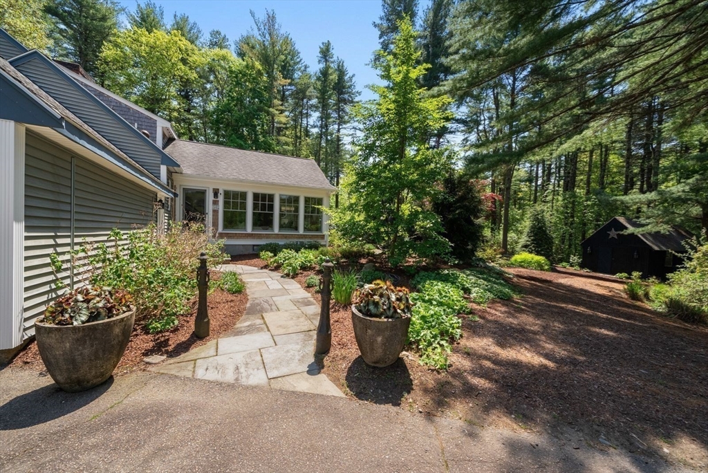 49 Walpole Street Dover, MA 02030 - Photo 29 of 40 a view of house with patio outdoor seating