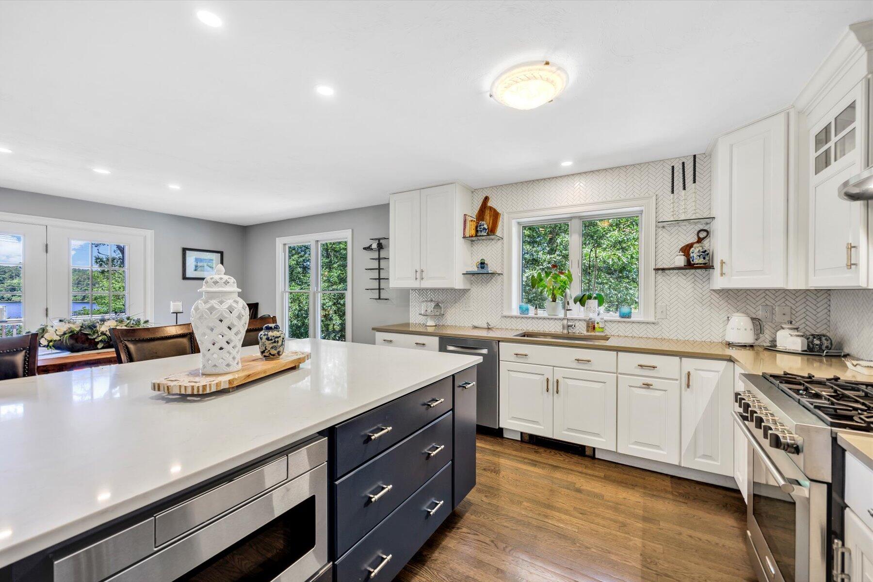 1 Ravens Nest Road Sandwich, MA 02563 - Photo 9 of 46 a view of a kitchen counter top space with stainless steel appliances granite countertop a stove and a sink