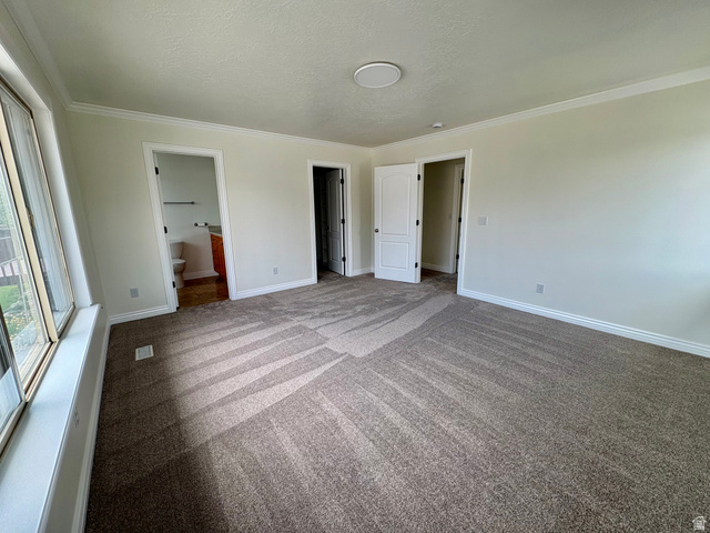 665 West State Road Lehi, UT 84043 - Photo 7 of 30 Spacious room featuring neutral carpeting, a large window, and multiple interior doors