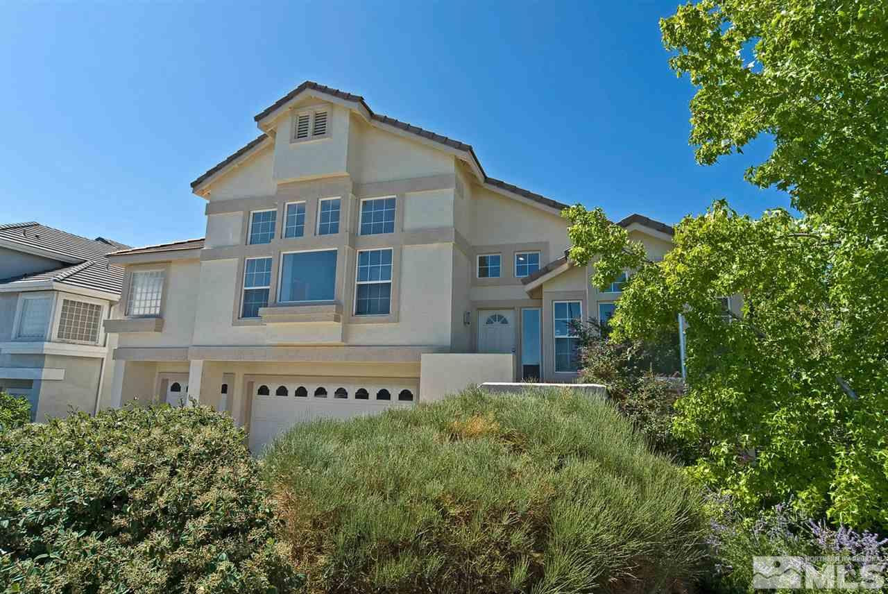 6030 Sunrise Meadows Loop Reno, NV 89519 - Photo 1 of 22 a front view of a house with a yard