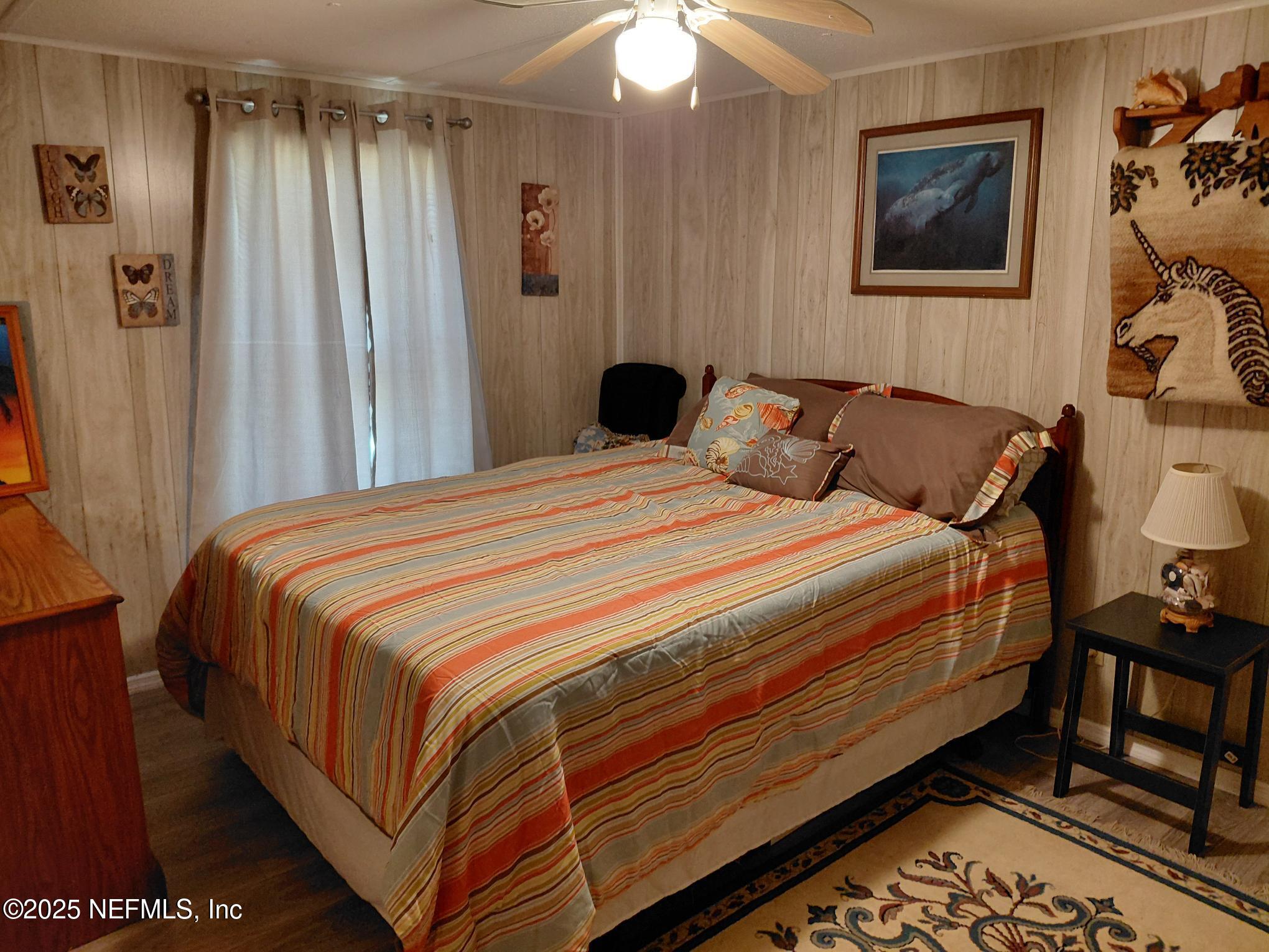 110 Glenside Street Georgetown, FL 32139 - Photo 15 of 18 a bedroom with a bed and a mirror