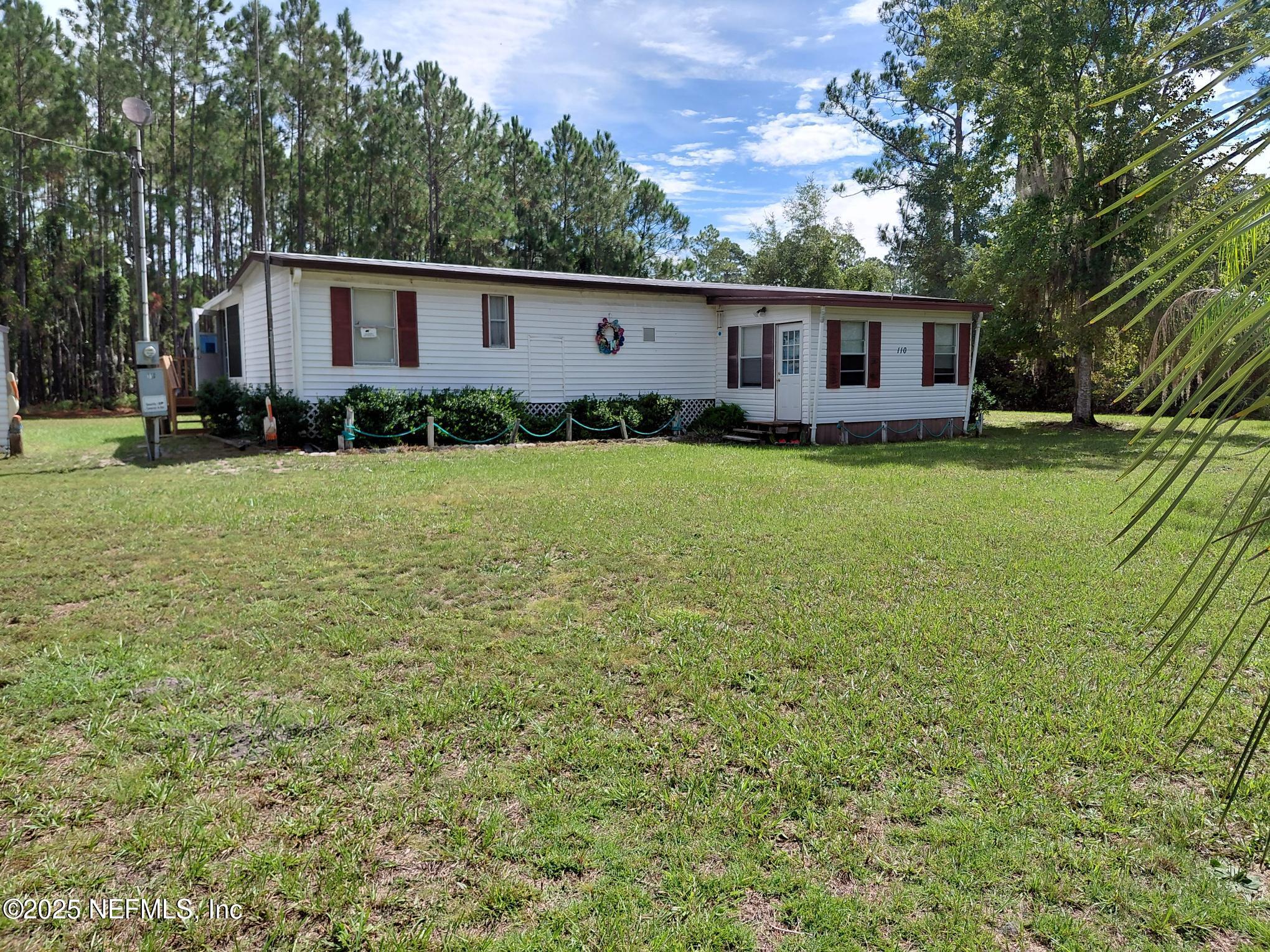 110 Glenside Street Georgetown, FL 32139 - Photo 3 of 18 a view of a house with backyard and garden