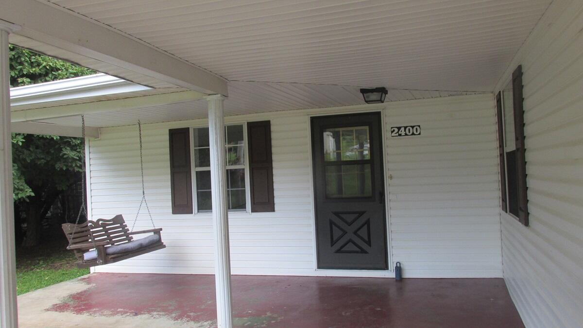 2400 Rutrough Road Southeast Roanoke, VA 24014 - Photo 1 of 21 front view of a house with a glass door