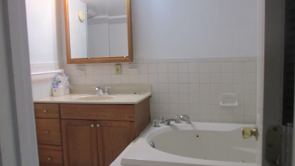2400 Rutrough Road Southeast Roanoke, VA 24014 - Photo 16 of 21 a bathroom with a sink and a bathtub