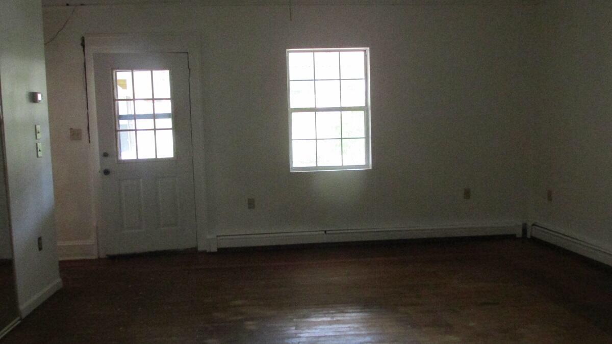 2400 Rutrough Road Southeast Roanoke, VA 24014 - Photo 20 of 21 an empty room with wooden floor and windows