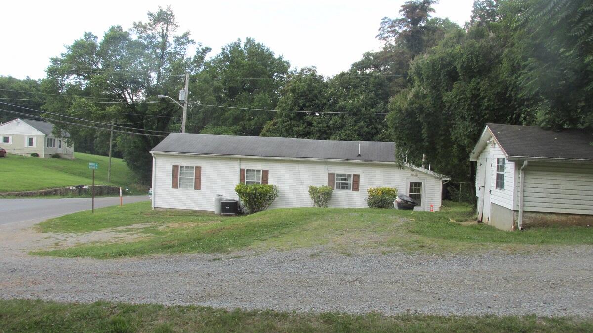 2400 Rutrough Road Southeast Roanoke, VA 24014 - Photo 3 of 21 front view of a house and a yard