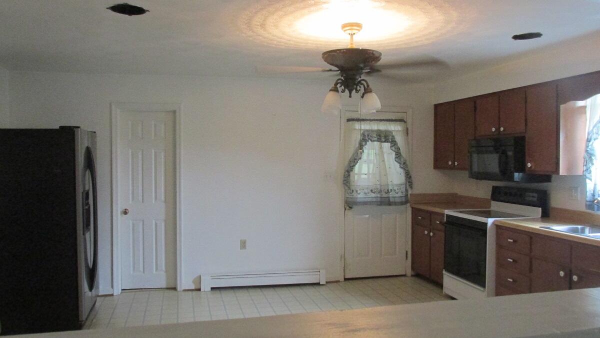 2400 Rutrough Road Southeast Roanoke, VA 24014 - Photo 10 of 21 a kitchen with stainless steel appliances a stove and a refrigerator