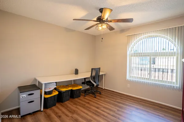 a bedroom with furniture and a window