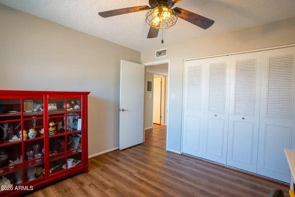 wooden floor in an empty room with a bookshelf