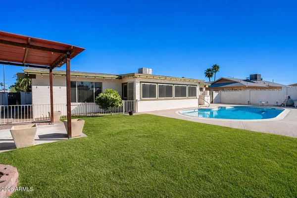a view of a house with a yard porch and sitting area