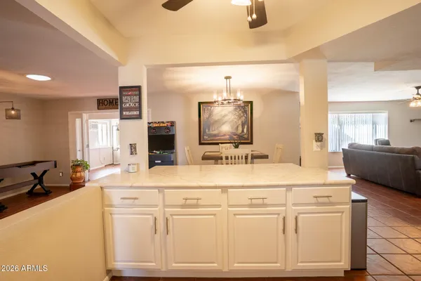 a bathroom with a sink vanity and mirror