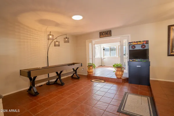 a living room with furniture and a rug