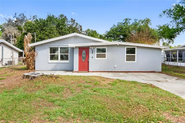 a house with trees in the background