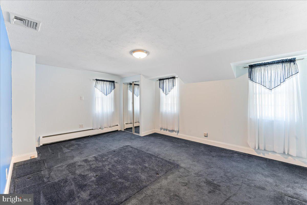 1449 Burmont Road Drexel Hill, PA 19026 - Photo 13 of 27 an empty room with windows