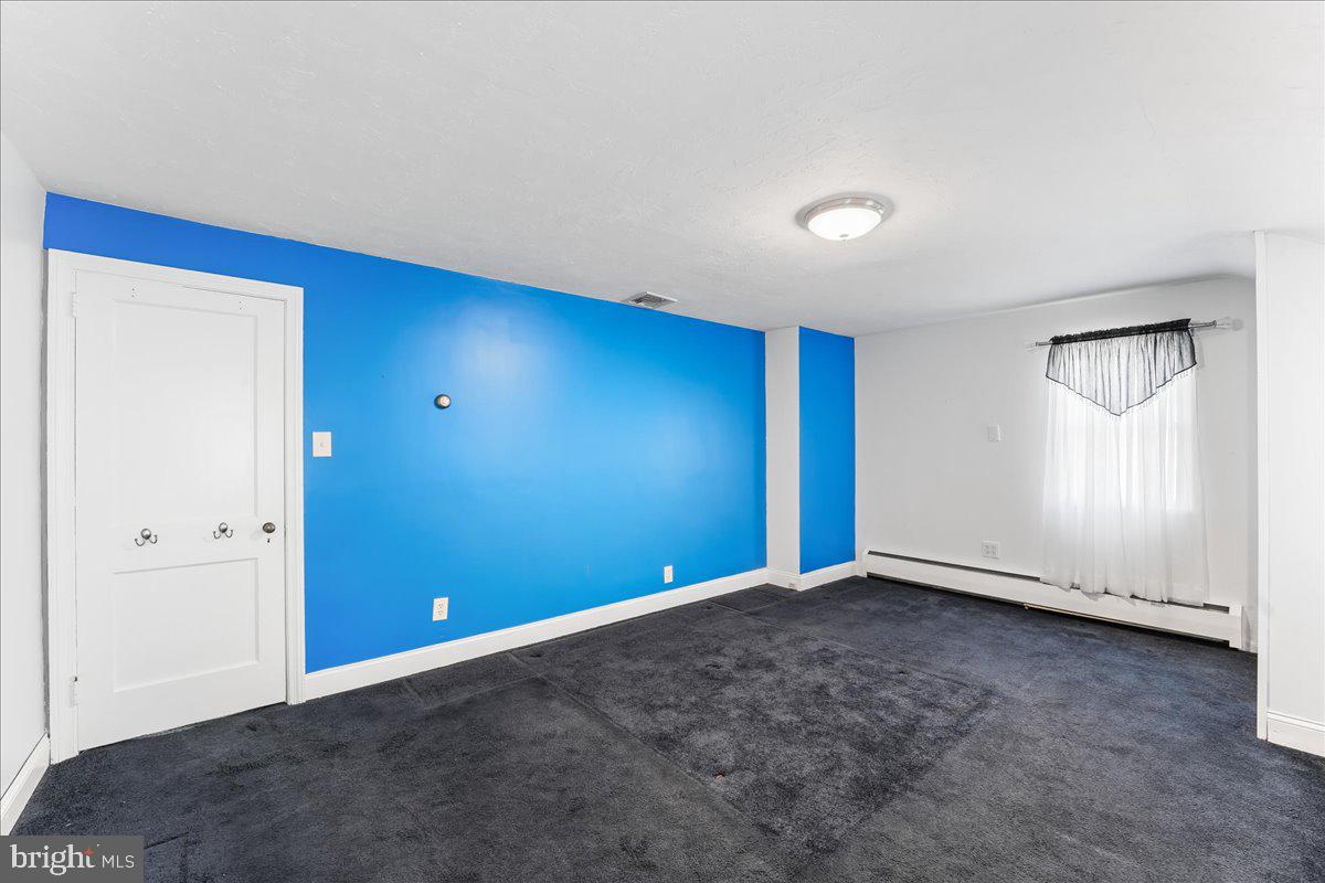 1449 Burmont Road Drexel Hill, PA 19026 - Photo 15 of 27 a view of an empty room with a window