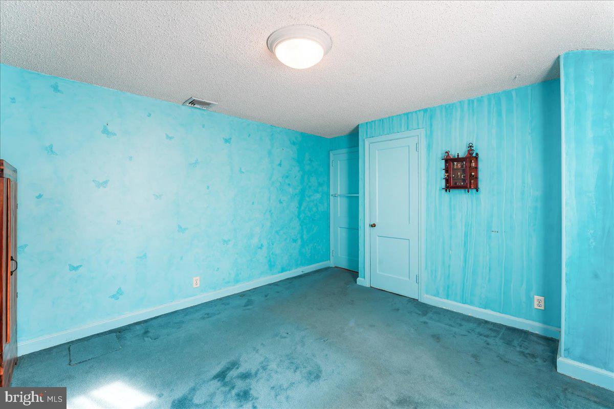 1449 Burmont Road Drexel Hill, PA 19026 - Photo 17 of 27 an empty room with a wooden door