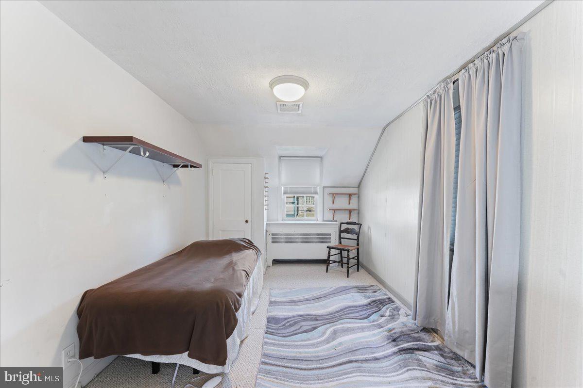 1449 Burmont Road Drexel Hill, PA 19026 - Photo 20 of 27 a bedroom with a bed and furniture