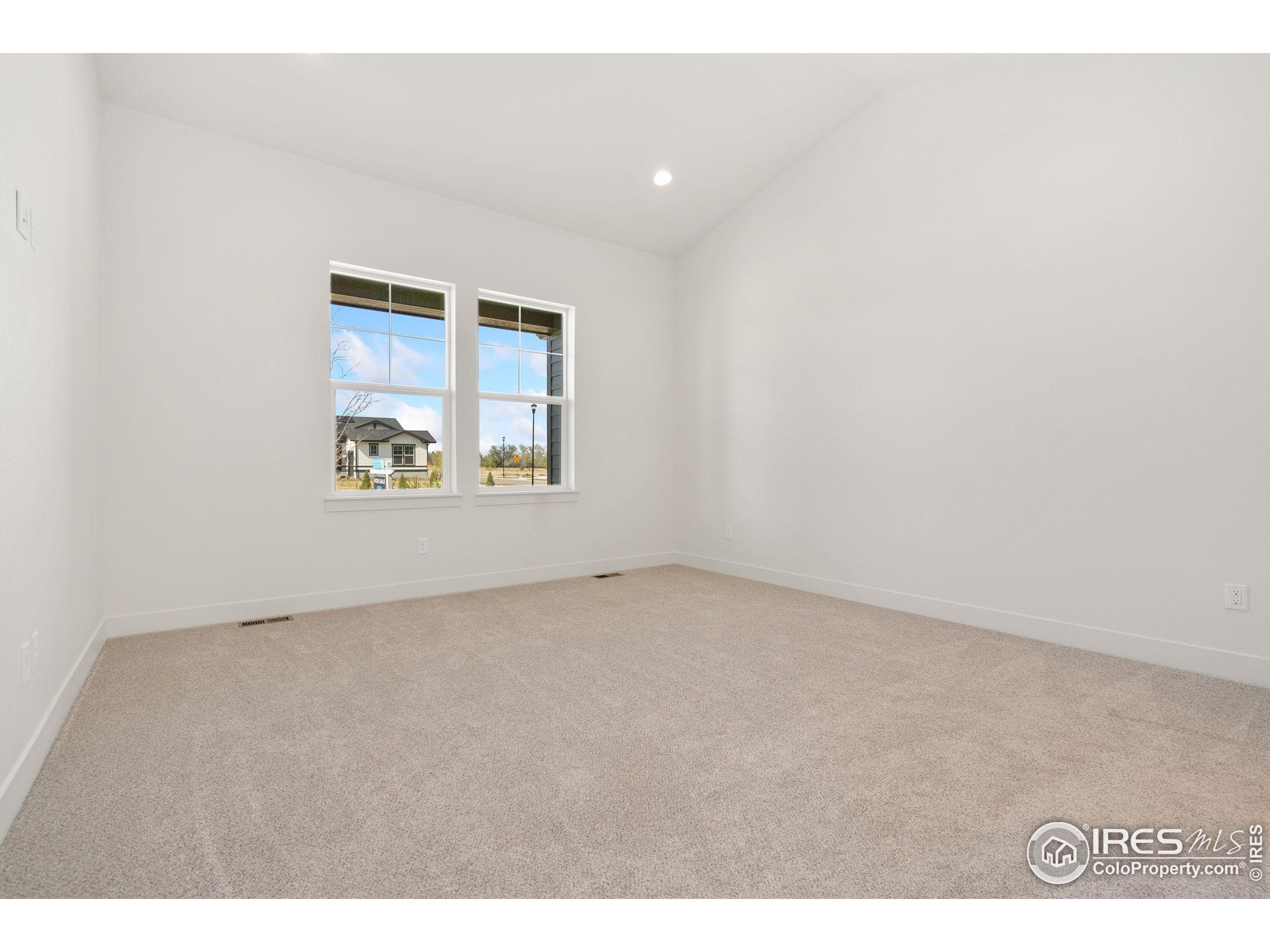 2978 Fleet Drive, Unit 4 Fort Collins, CO 80524 - Photo 11 of 17 a view of an empty room with a window