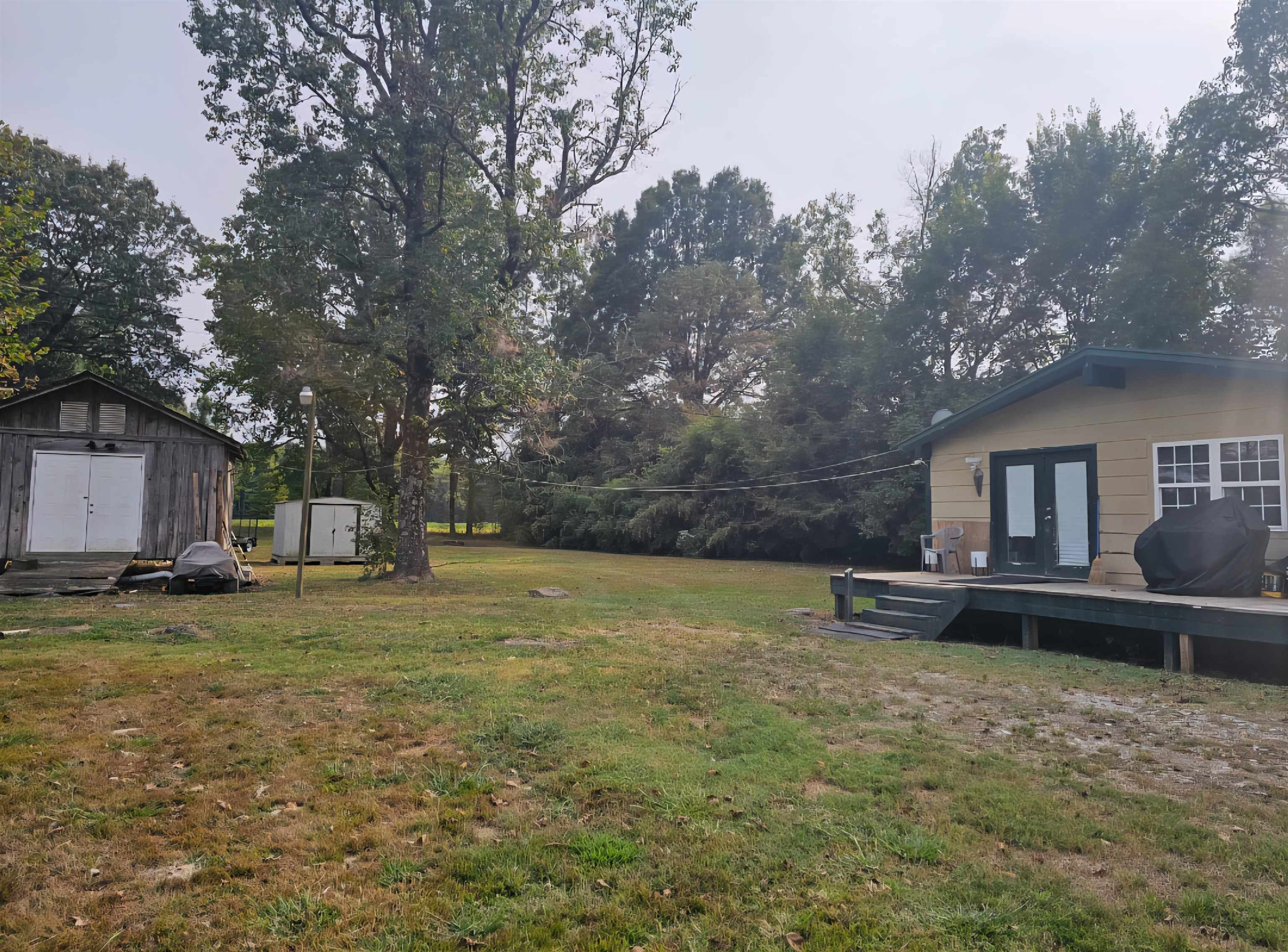 556 Shepp Road Stanton, TN 38069 - Photo 2 of 2 a backyard of a house with table and chairs