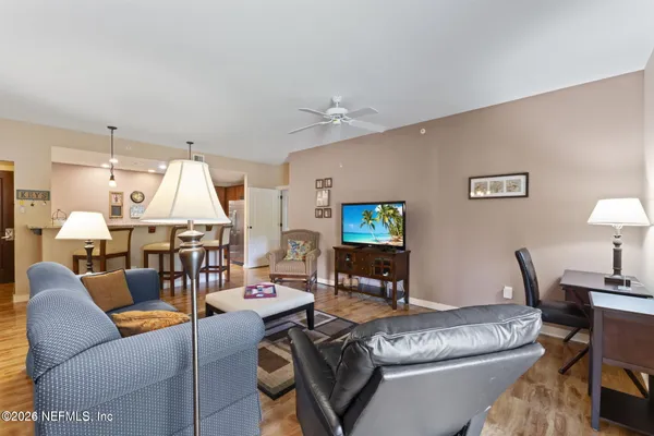 a kitchen with a sink a counter top space and cabinets