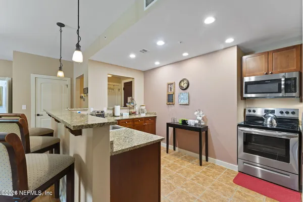 a kitchen with a stove and a microwave