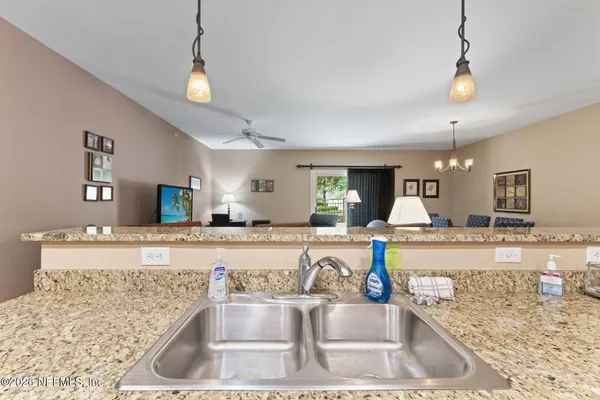 a kitchen with a refrigerator and a sink