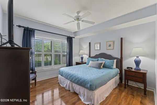 a view of walk in closet with clothes