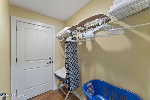 a spacious bedroom with a bed window and couch