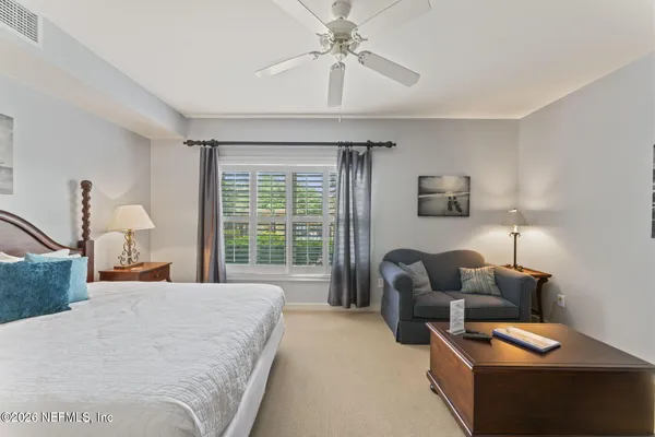 a bed room with a bed and a couch