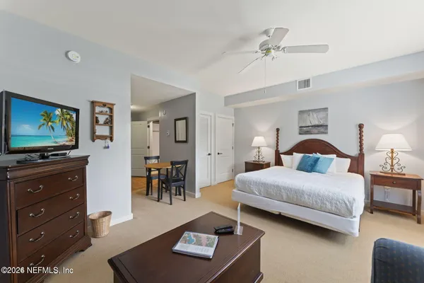 a kitchen with granite countertop wood cabinets and stainless steel appliances