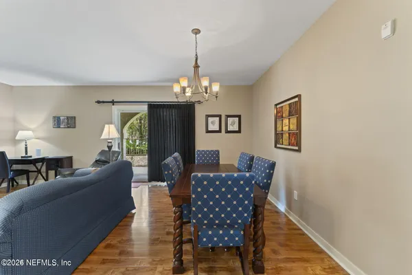a living room with furniture rug and window