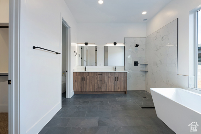 3145 Snow Cyn Road Hurricane, UT 84737 - Photo 13 of 38 Full bath featuring double vanity, a freestanding bath, recessed lighting, and a shower