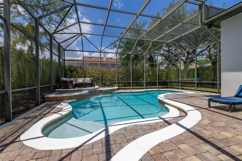8351 Bowden Way Windermere, FL 34786 - Photo 44 of 71 a view of a backyard with a patio and swimming pool
