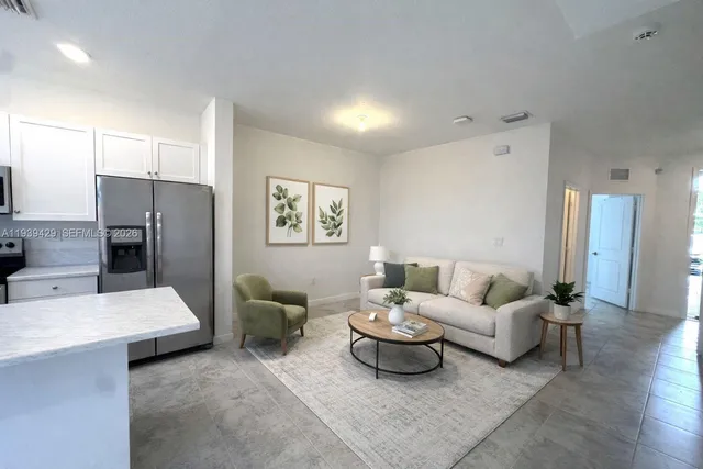 a living room with furniture and a table