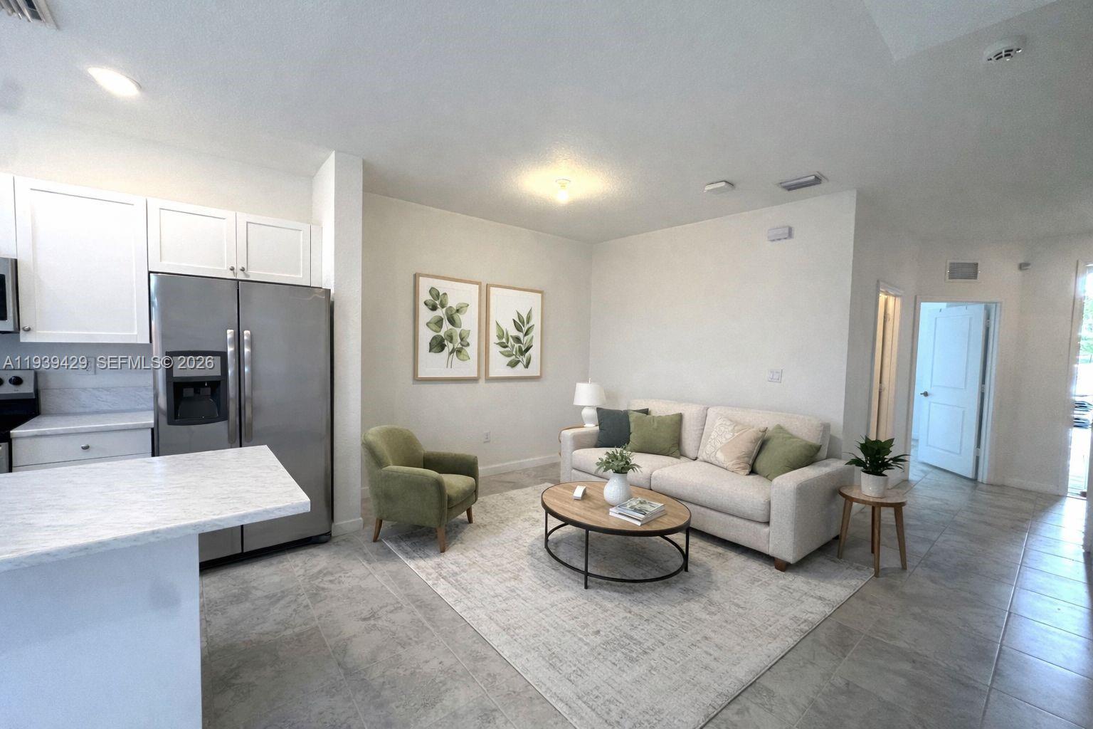 a living room with furniture and a table