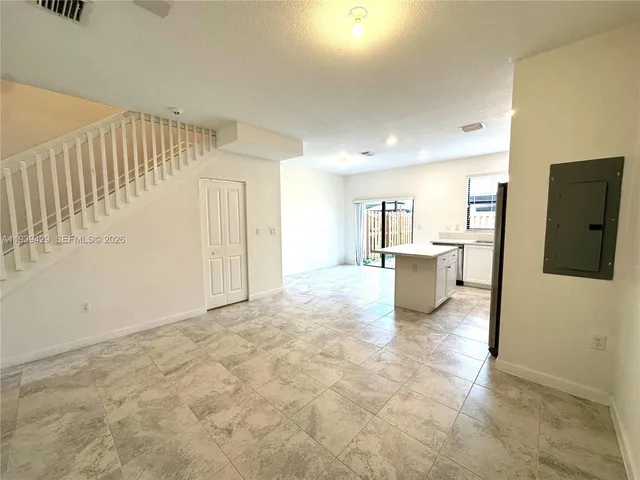 a view of a kitchen with a sink