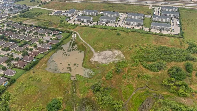 an aerial view of ocean residential houses with outdoor space
