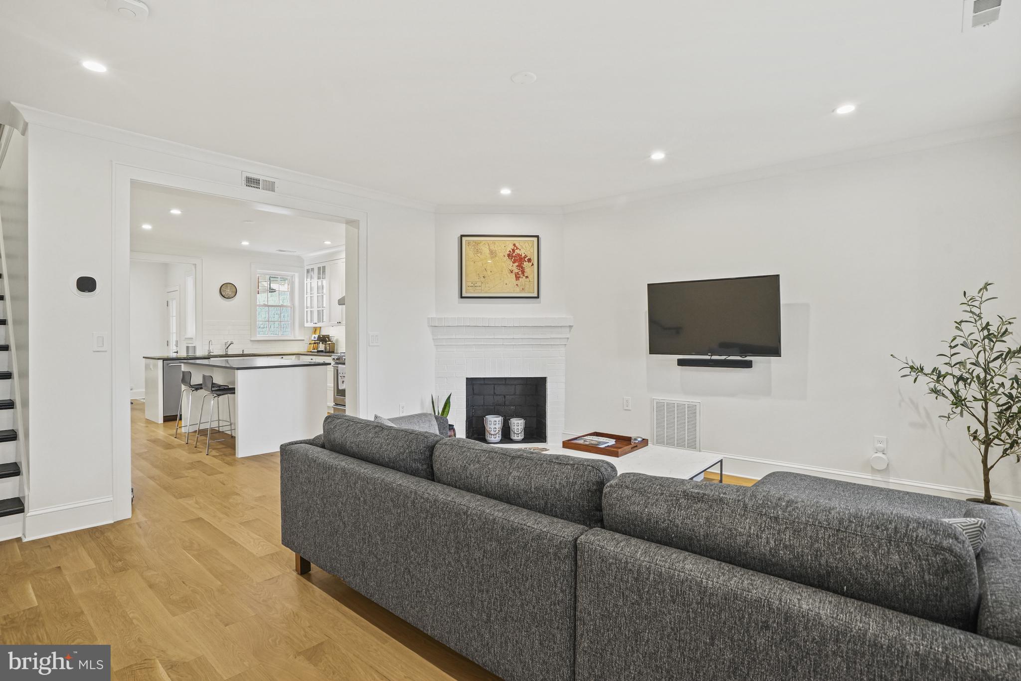 1920 35th Street Northwest Washington, DC 20007 - Photo 14 of 53 a living room with furniture and a flat screen tv