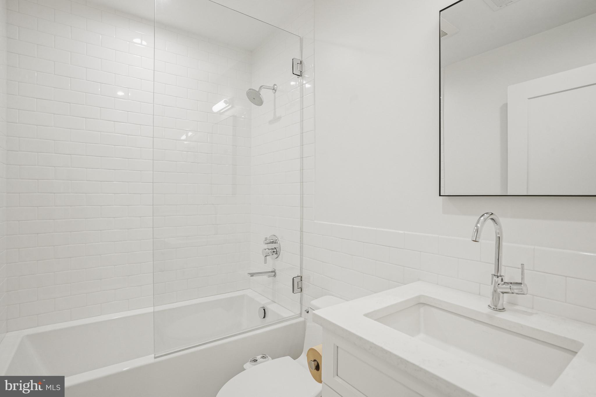 1920 35th Street Northwest Washington, DC 20007 - Photo 26 of 53 a bathroom with a sink a toilet and shower