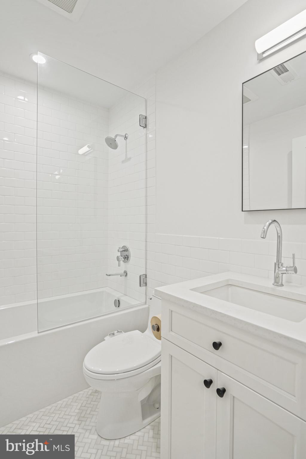 1920 35th Street Northwest Washington, DC 20007 - Photo 27 of 53 a bathroom with a sink a toilet and shower