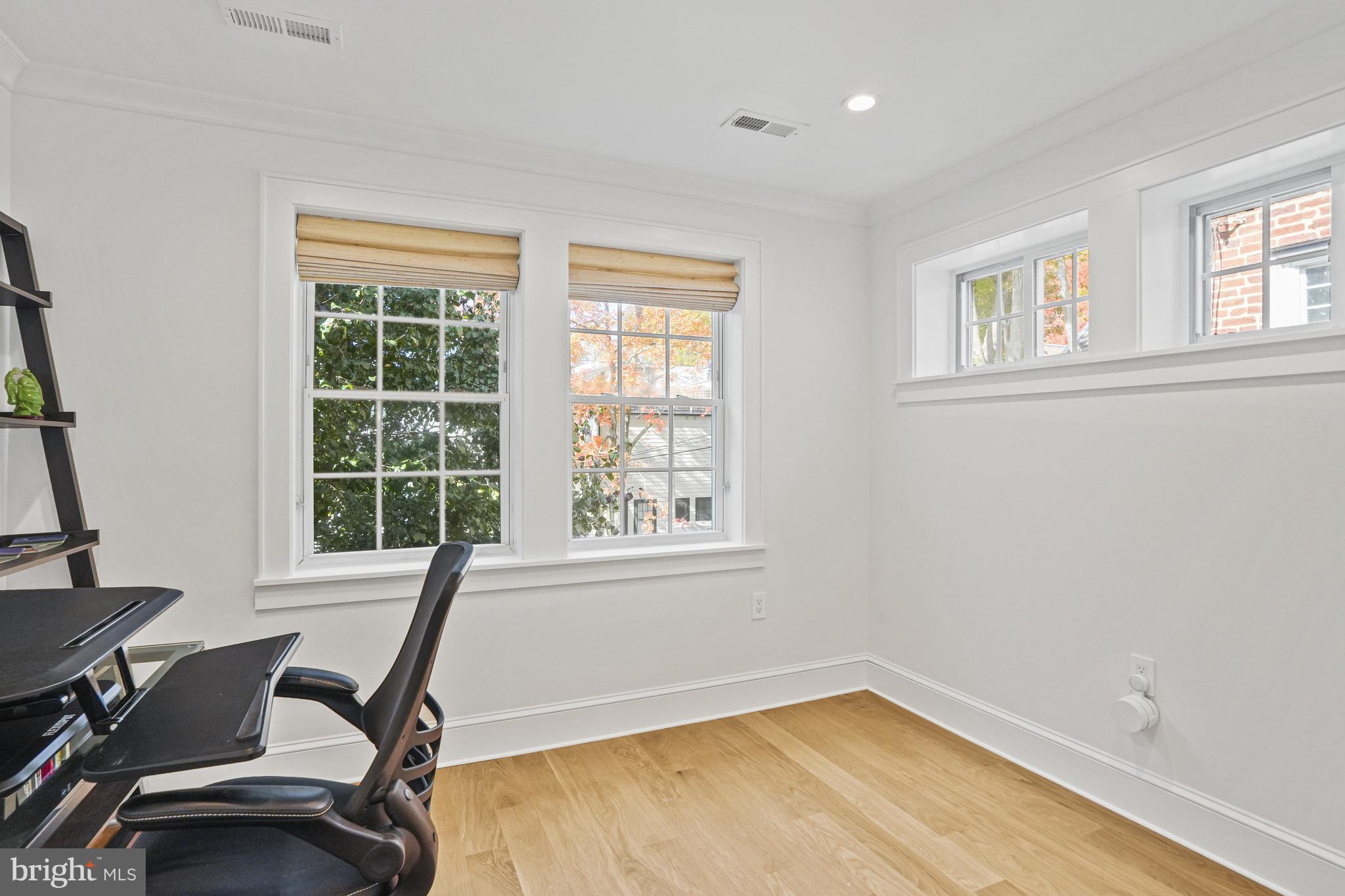 1920 35th Street Northwest Washington, DC 20007 - Photo 28 of 53 a view of a room with gym equipment and windows