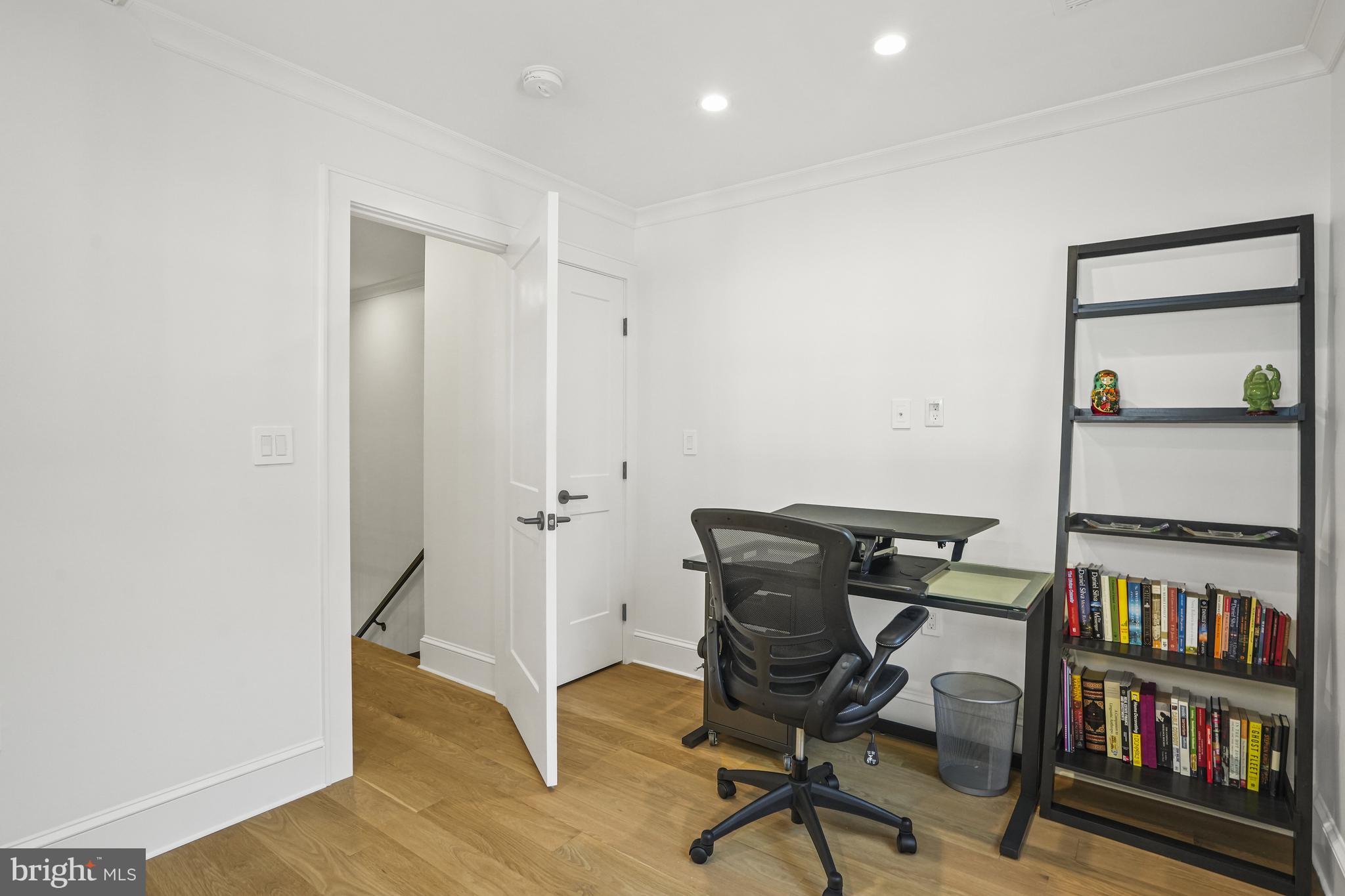1920 35th Street Northwest Washington, DC 20007 - Photo 29 of 53 a view of a workspace with furniture and wooden floor