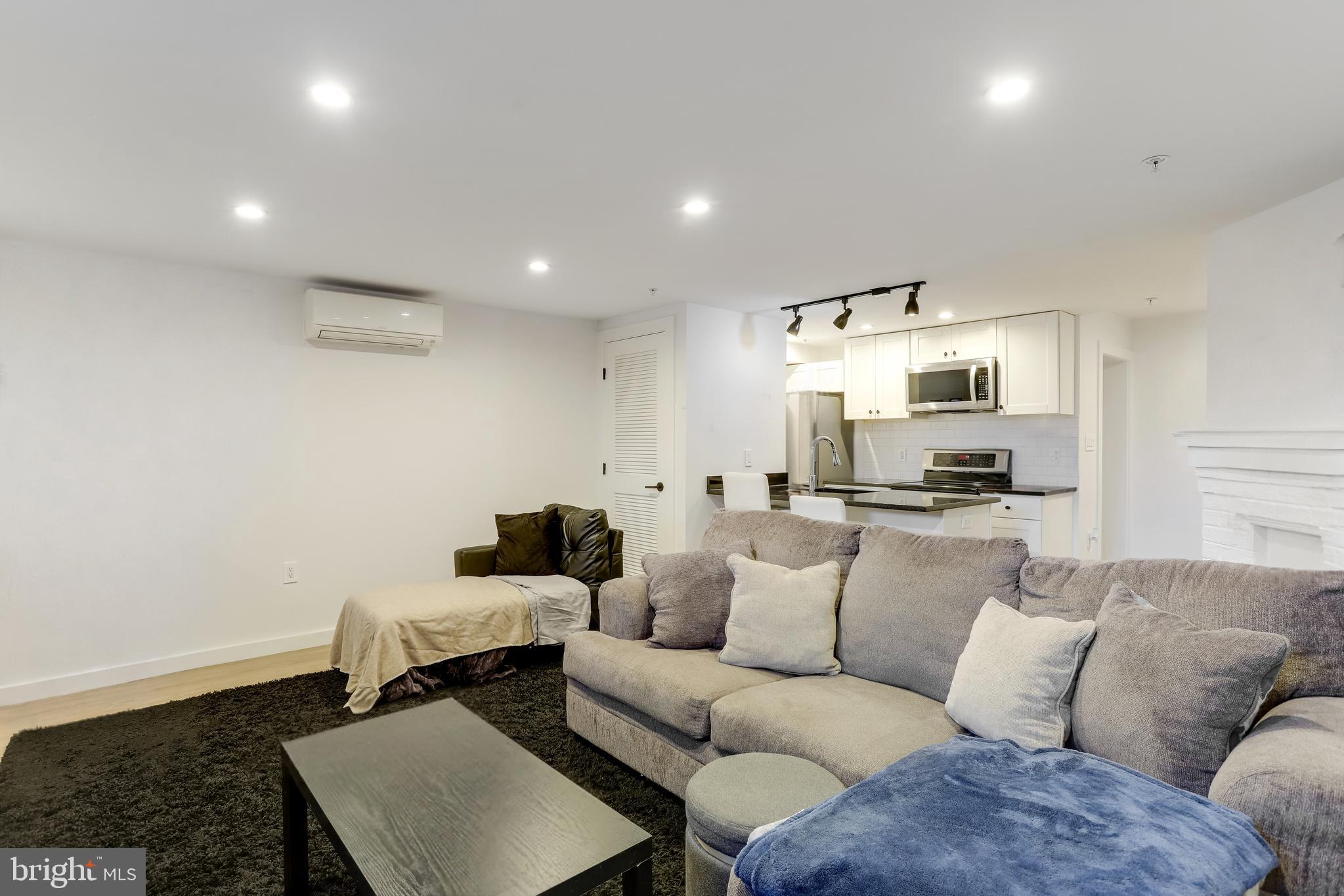 1920 35th Street Northwest Washington, DC 20007 - Photo 35 of 53 a view of a living room kitchen and a wooden floor