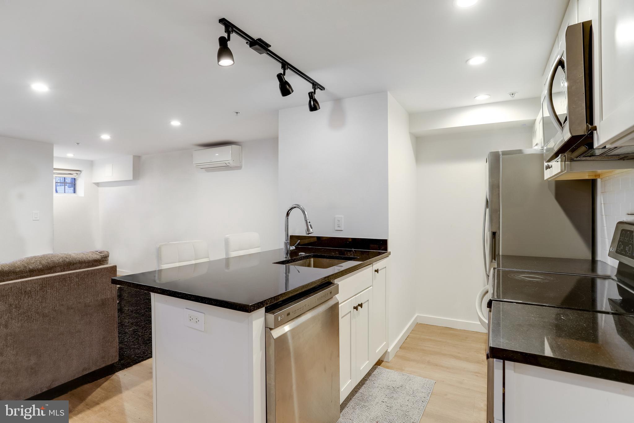1920 35th Street Northwest Washington, DC 20007 - Photo 38 of 53 a kitchen that has a sink stainless steel appliances and cabinets