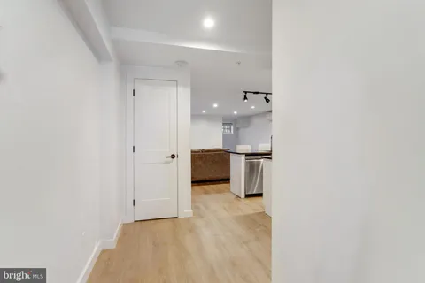 a bed room with a bed and a television