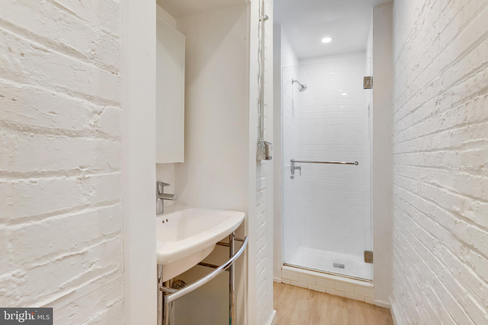 1920 35th Street Northwest Washington, DC 20007 - Photo 44 of 53 a bathroom with a bathtub and a shower