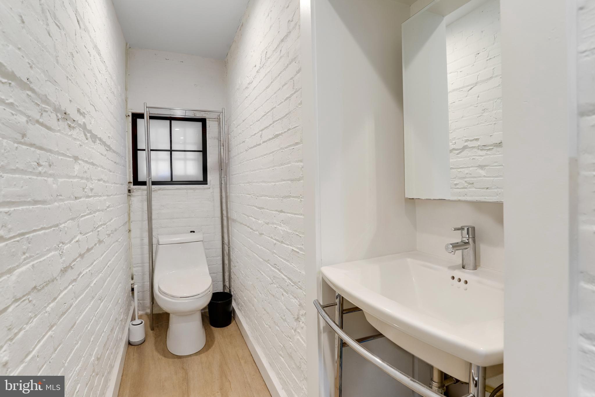 1920 35th Street Northwest Washington, DC 20007 - Photo 45 of 53 a bathroom with a sink and a toilet