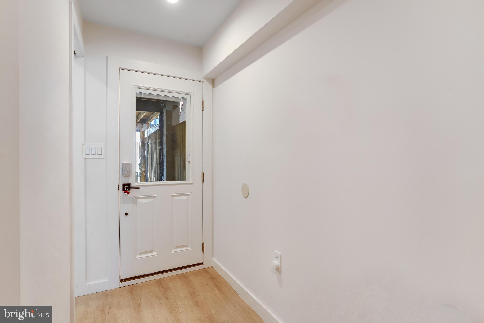 1920 35th Street Northwest Washington, DC 20007 - Photo 47 of 53 a view of a hallway with wooden floor