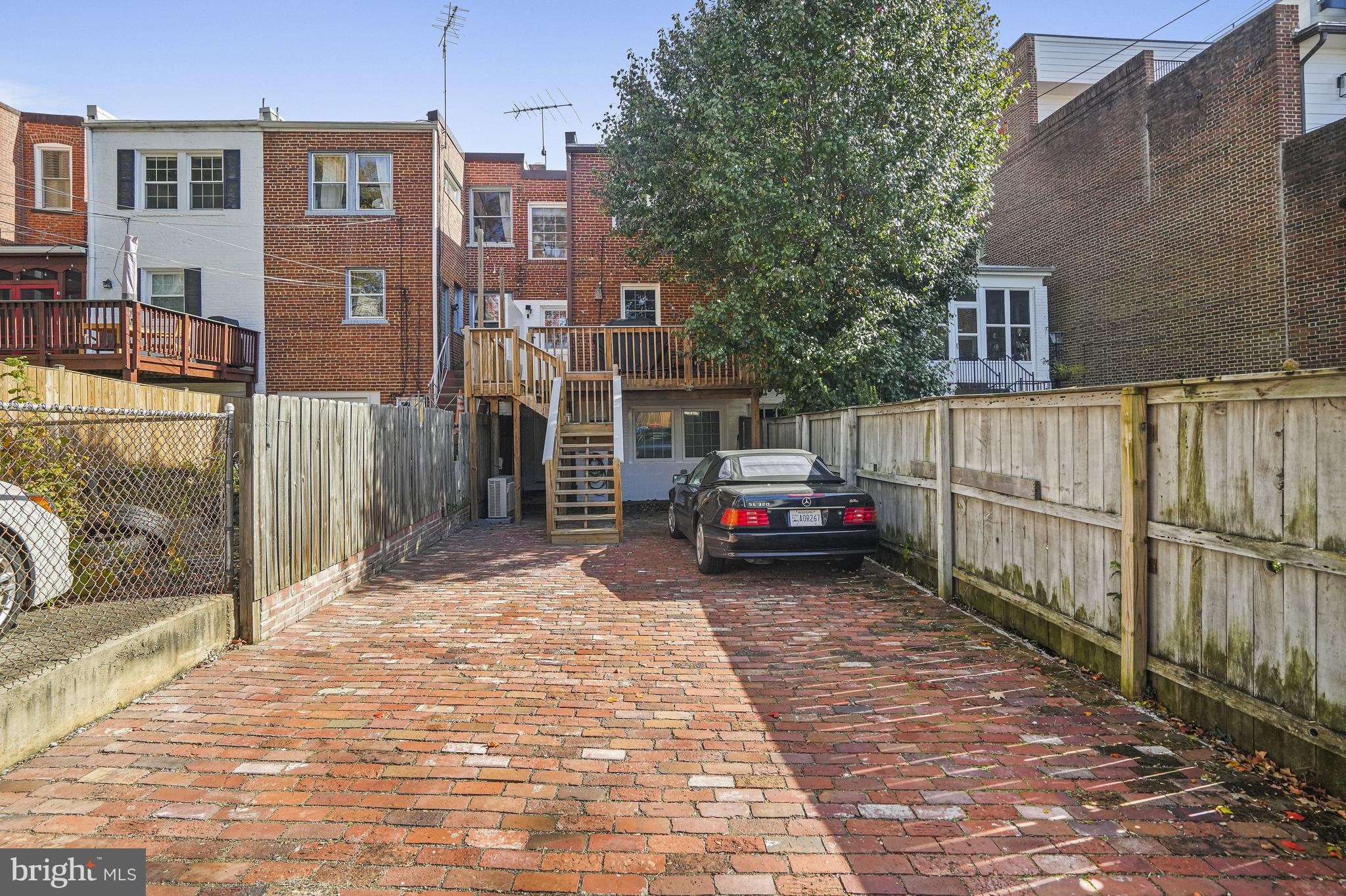 1920 35th Street Northwest Washington, DC 20007 - Photo 51 of 53 a view of a house with a backyard and stairs